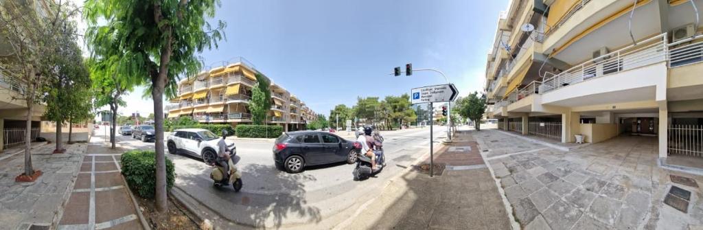 a street with two motorcycles parked next to a building at Loutraki Suites in Loutraki