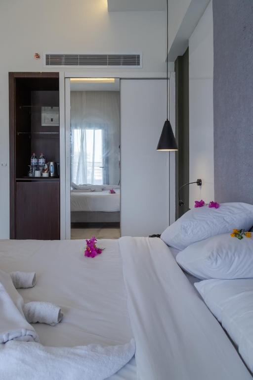 Postel nebo postele na pokoji v ubytování Nordlicht Hotel Marina Al Alamein