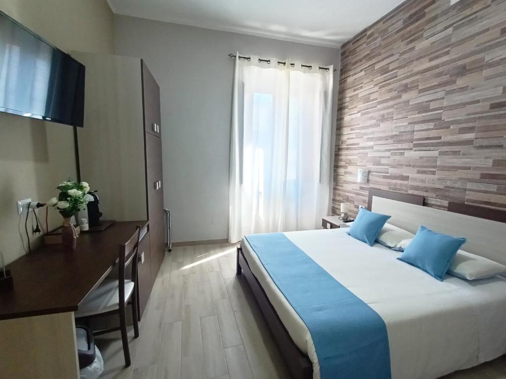 Postel nebo postele na pokoji v ubytování Domos La Corte Ghibellina