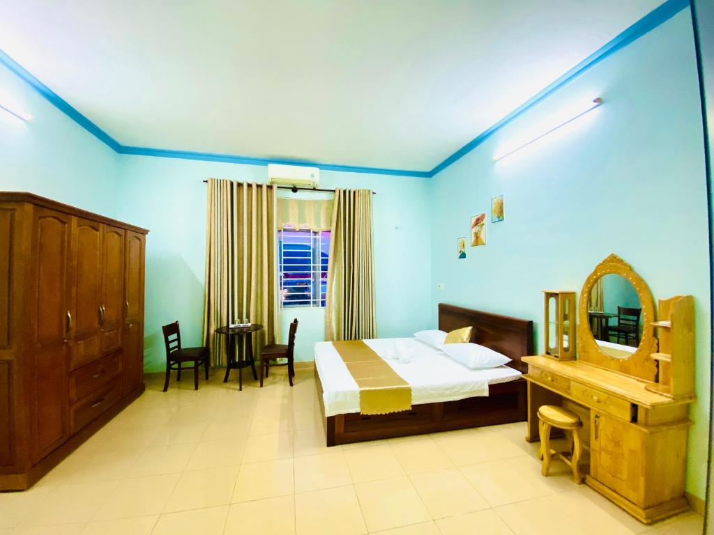 Postel nebo postele na pokoji v ubytování Phú Mỹ Port Motel