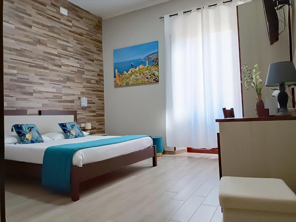 Postel nebo postele na pokoji v ubytování Domos La Corte Ghibellina