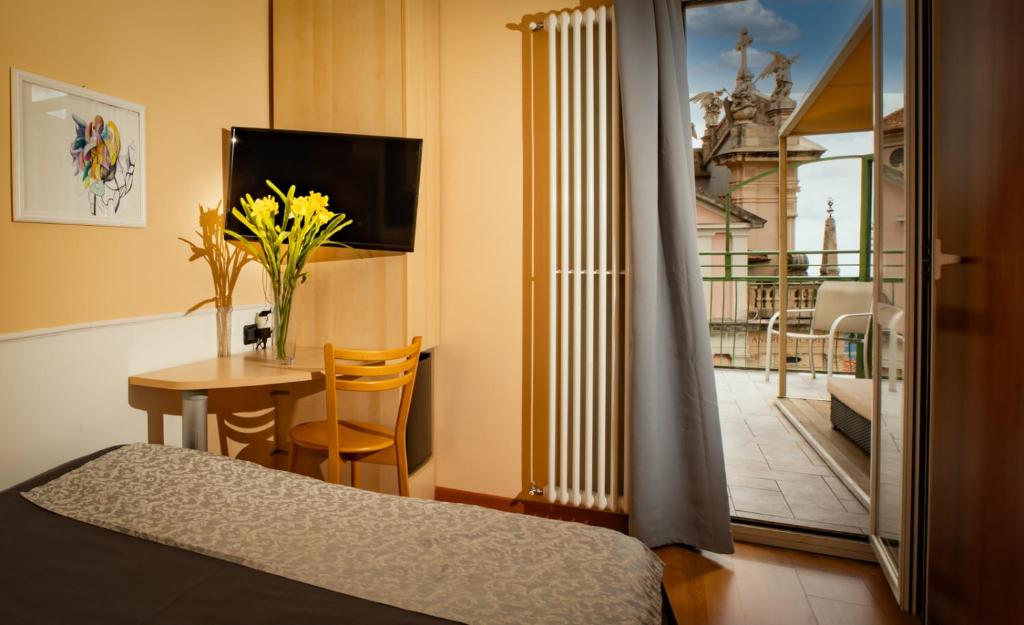 TV a/nebo společenská místnost v ubytování Hotel Vista Lago