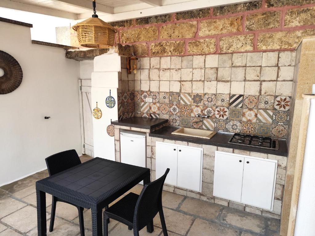 A kitchen or kitchenette at La Corte dei Marchesi