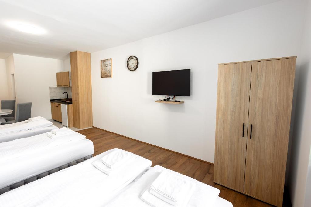 Postel nebo postele na pokoji v ubytování Luna Nera apartments