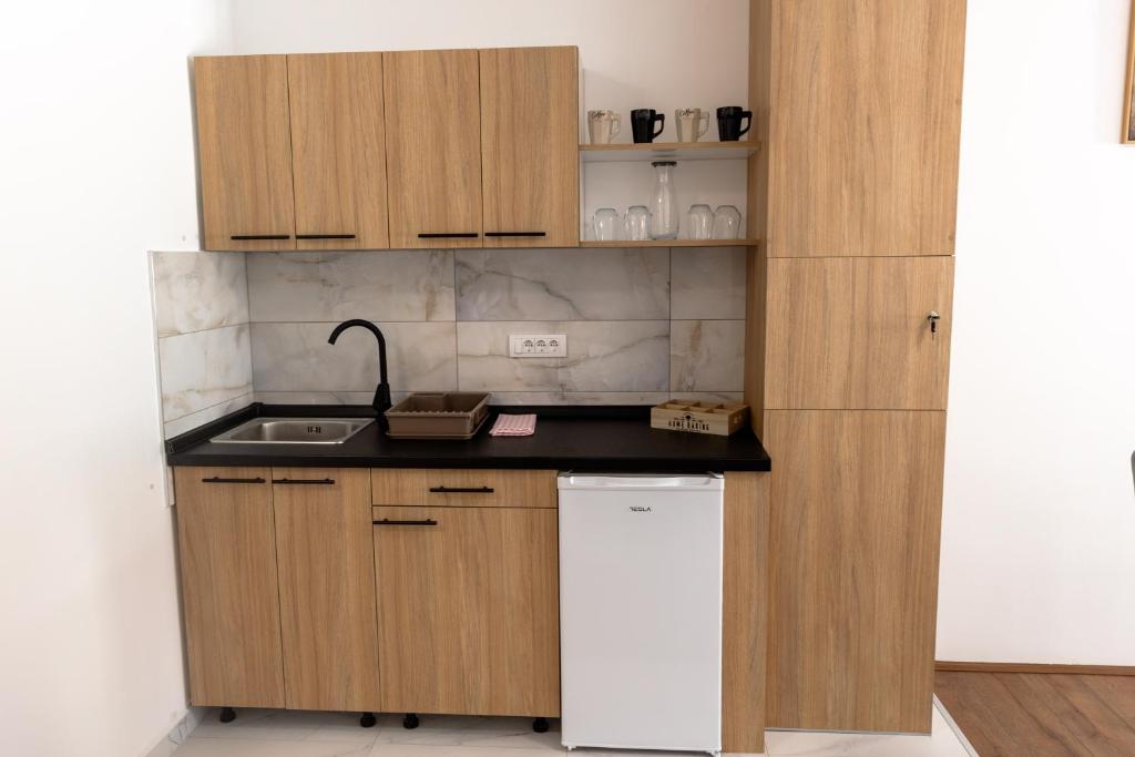 Kuchyň nebo kuchyňský kout v ubytování Luna Nera apartments