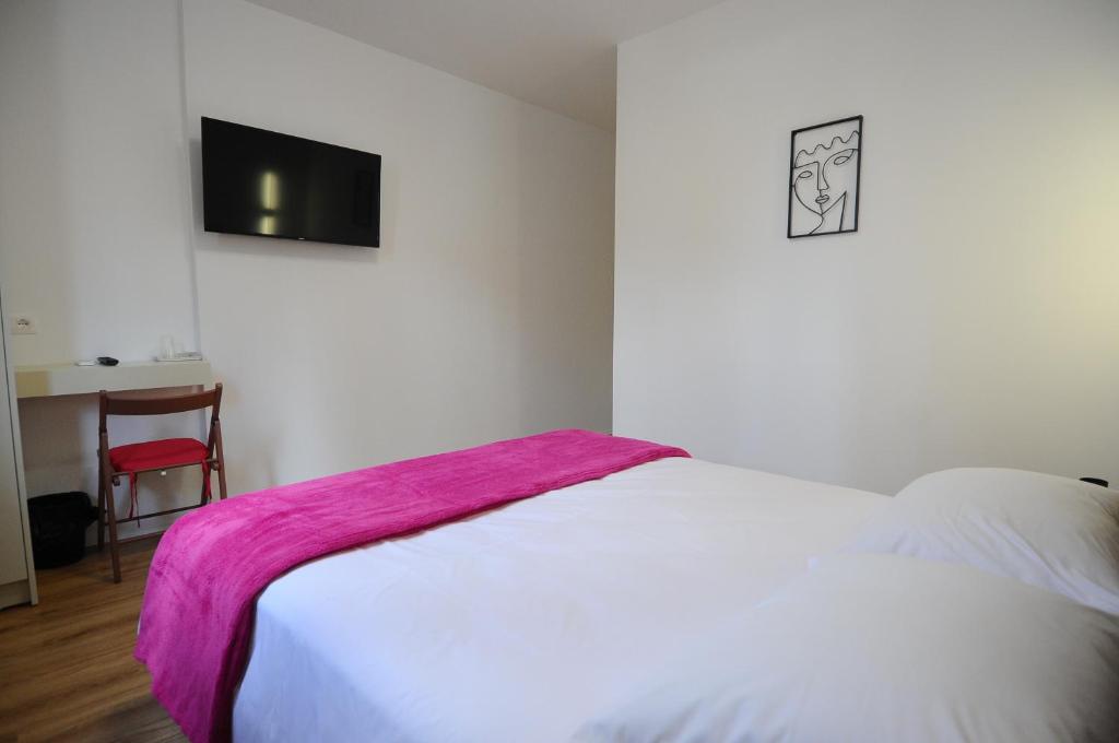 Postel nebo postele na pokoji v ubytování New Boulevard Inn