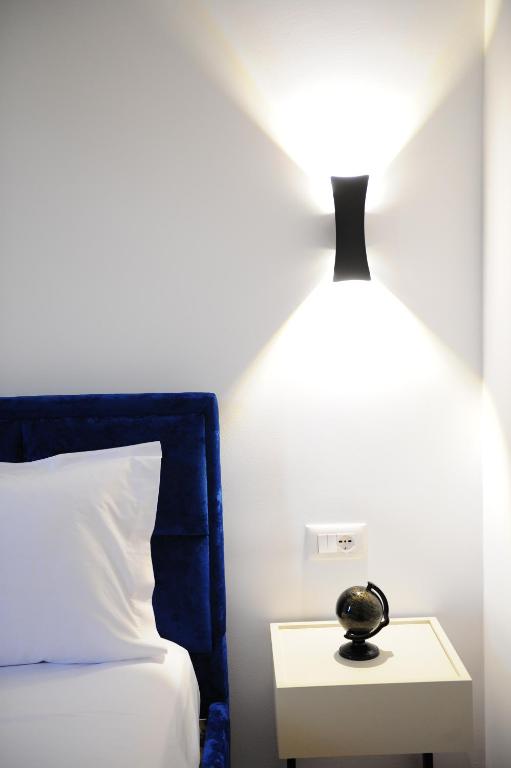 Postel nebo postele na pokoji v ubytování New Boulevard Inn