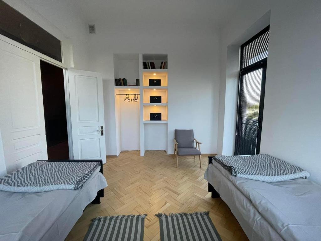 Postel nebo postele na pokoji v ubytování Twins Guest House