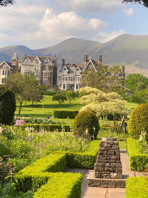 a garden in front of a large house at Brundholme in Keswick