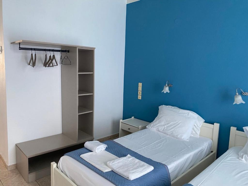 Postel nebo postele na pokoji v ubytování Faros Rooms