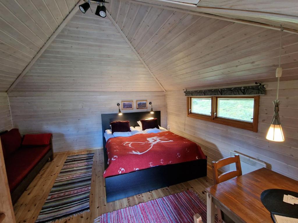 Postel nebo postele na pokoji v ubytování Reindeer Lodge