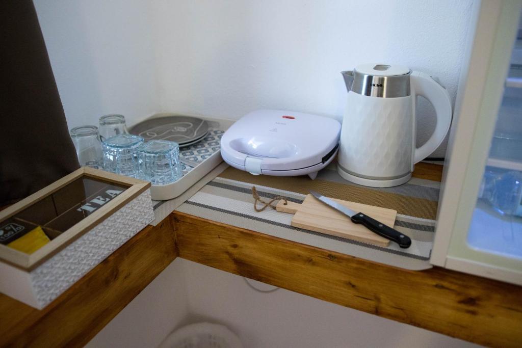 Kuchyň nebo kuchyňský kout v ubytování G&A Rooms Marmari
