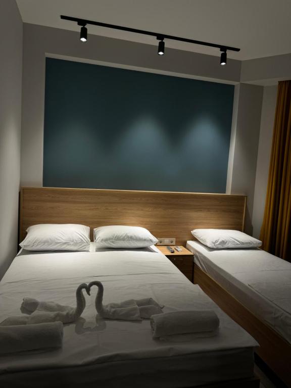 Postel nebo postele na pokoji v ubytování Hotel Boutique Adam