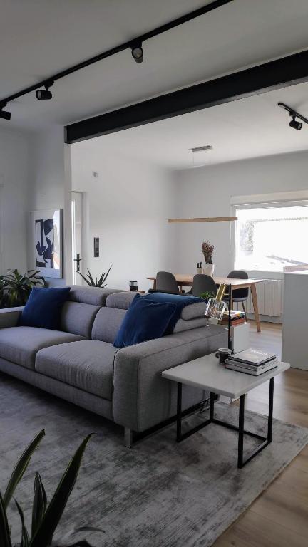 a living room with a couch and a table at Valdoviño Experience in Valdoviño