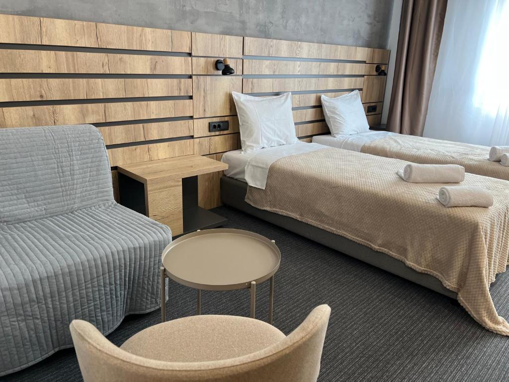 Posteľ alebo postele v izbe v ubytovaní Sremsky inn