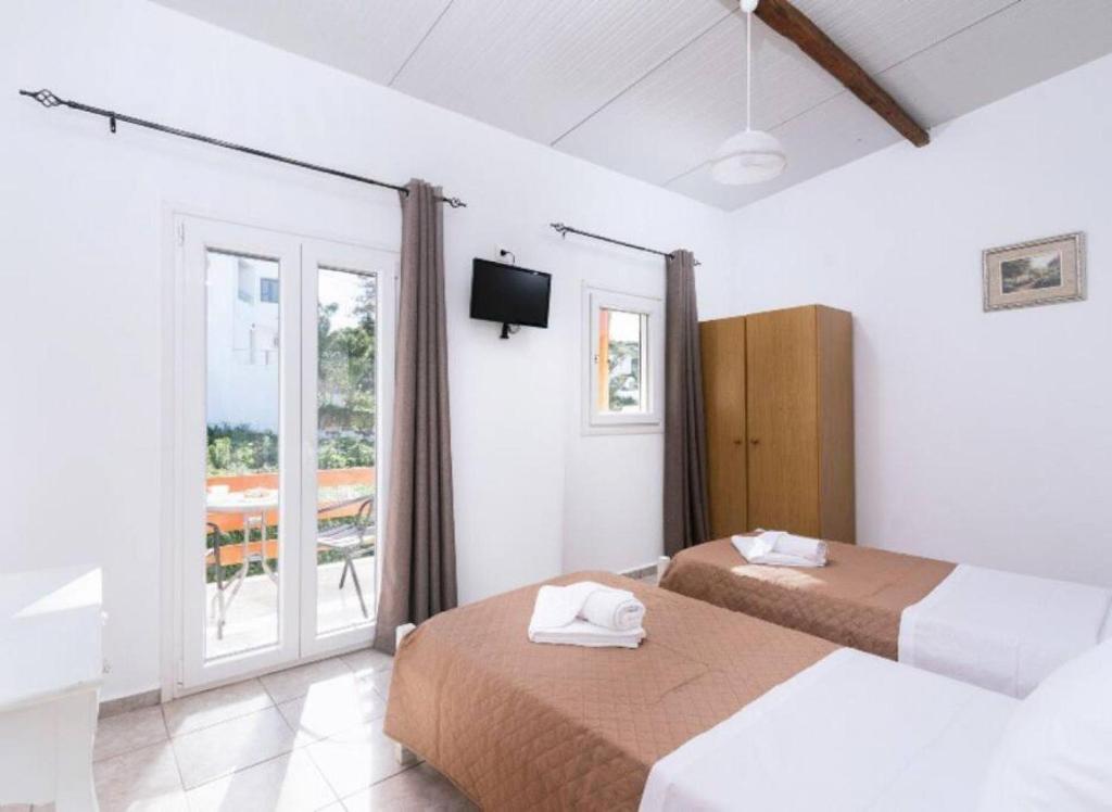 Posteľ alebo postele v izbe v ubytovaní Apartment Panagiotis