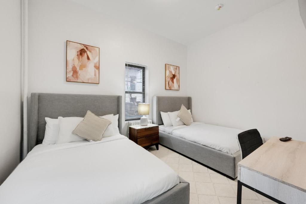 Postel nebo postele na pokoji v ubytování Bay Ridge ApartHotel