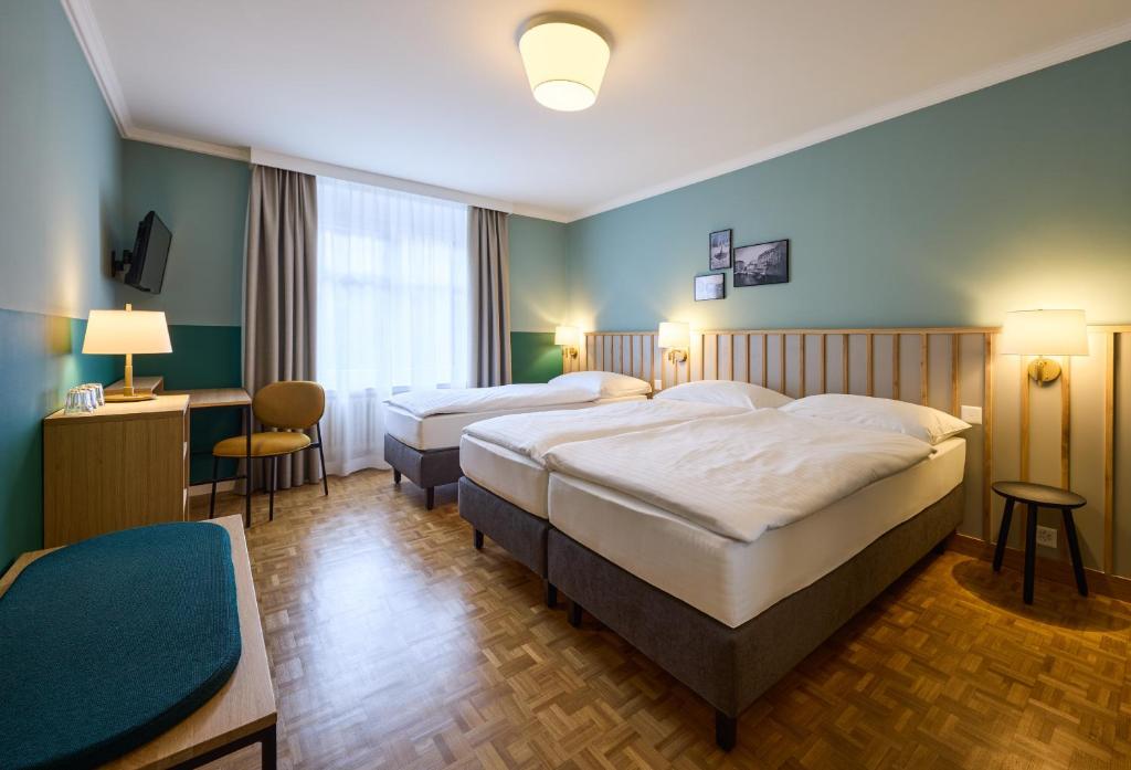 Voodi või voodid majutusasutuse Hotel Limmathof toas