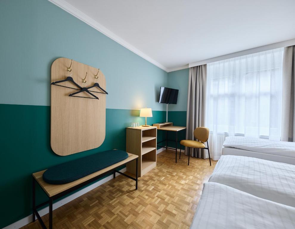Voodi või voodid majutusasutuse Hotel Limmathof toas