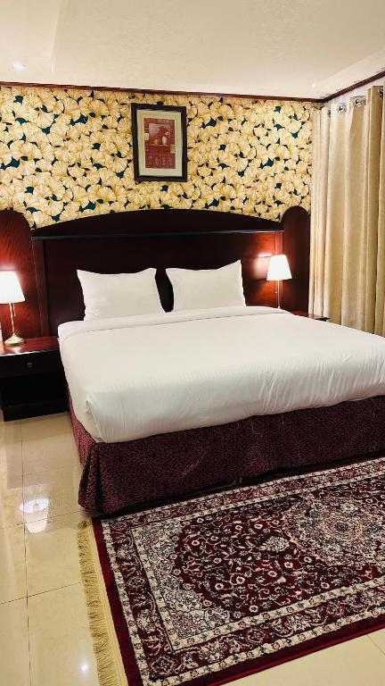 Postel nebo postele na pokoji v ubytování Star Dahlia Hotel