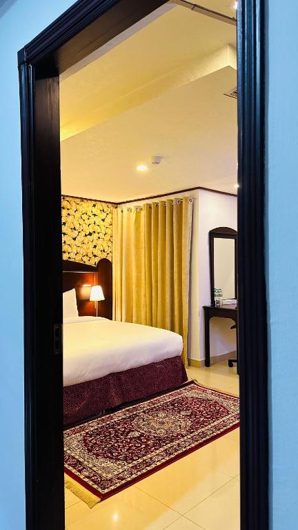 Postel nebo postele na pokoji v ubytování Star Dahlia Hotel