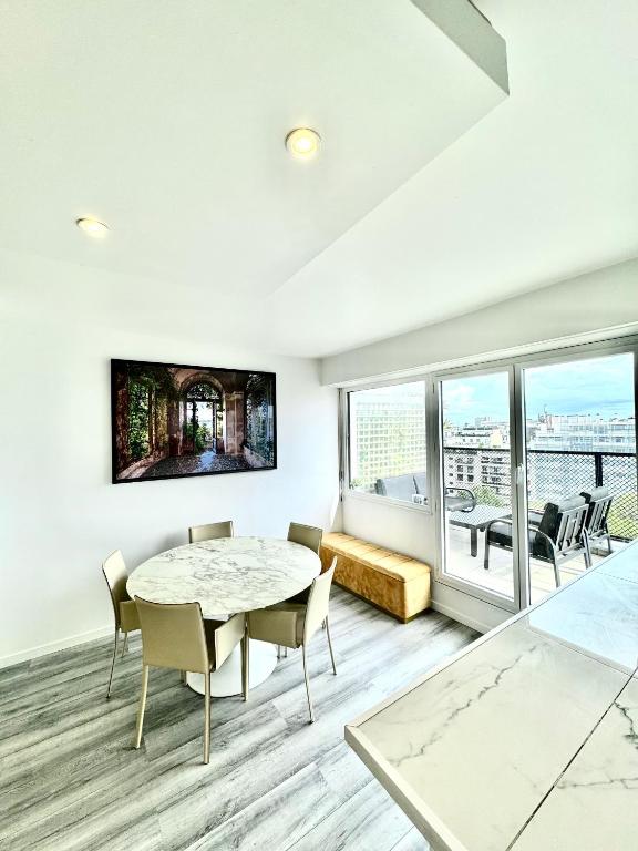 A television and/or entertainment centre at Rooftop Eiffel Tower - Full AC