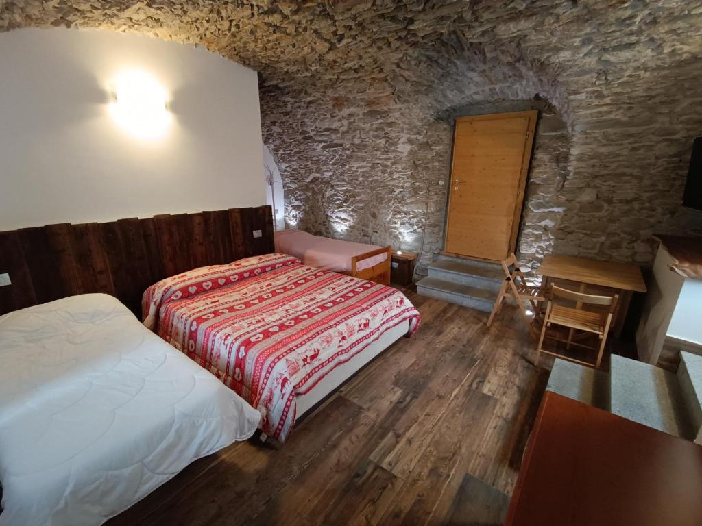 Postel nebo postele na pokoji v ubytování B&B La Presef
