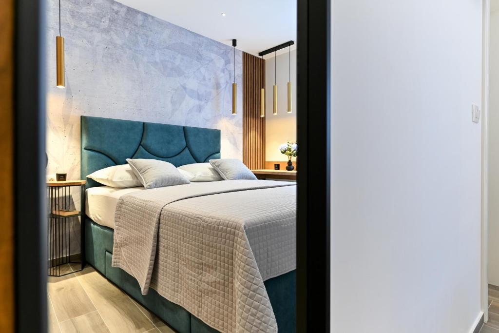 Posteľ alebo postele v izbe v ubytovaní Apartments and Rooms Nekic