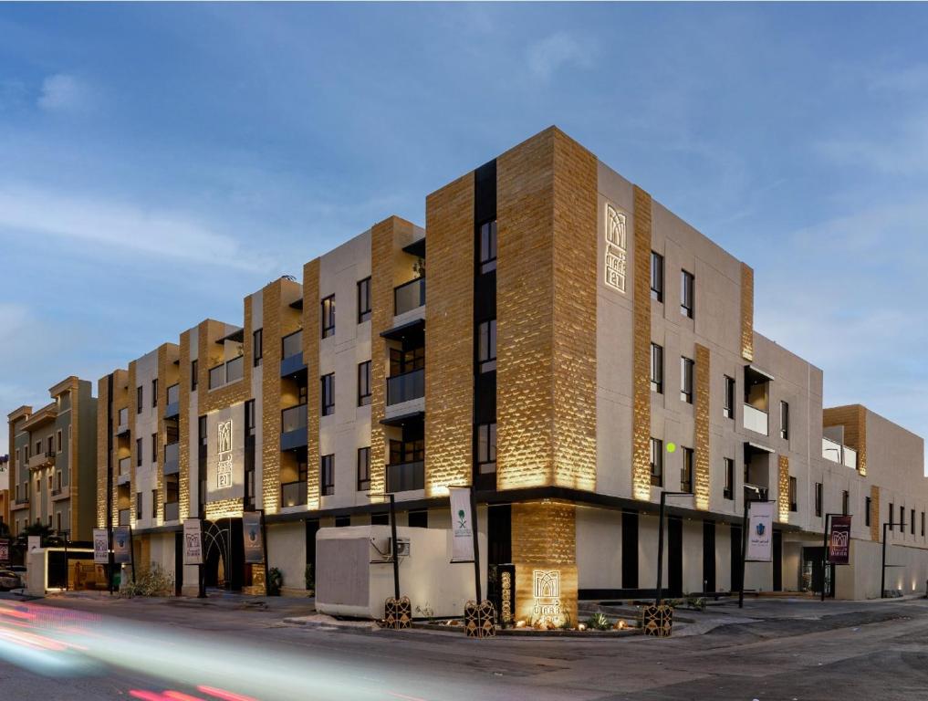 a large building on the side of a street at Luxury Modern Apartment with Gym and Lounge in Riyadh