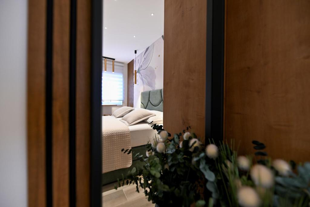 Posteľ alebo postele v izbe v ubytovaní Apartments and Rooms Nekic