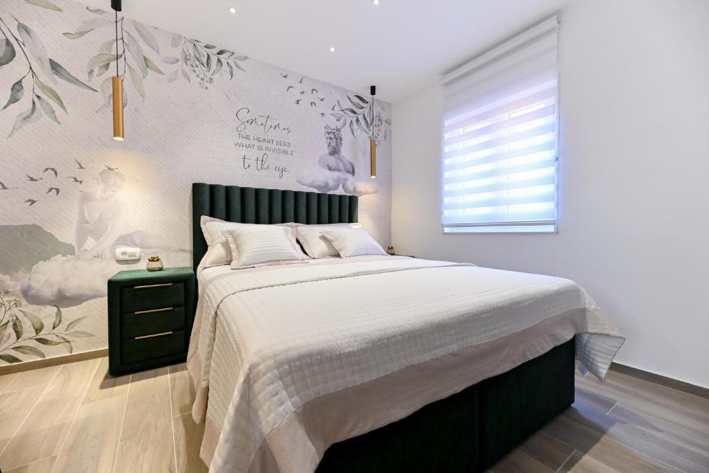 Posteľ alebo postele v izbe v ubytovaní Apartments and Rooms Nekic