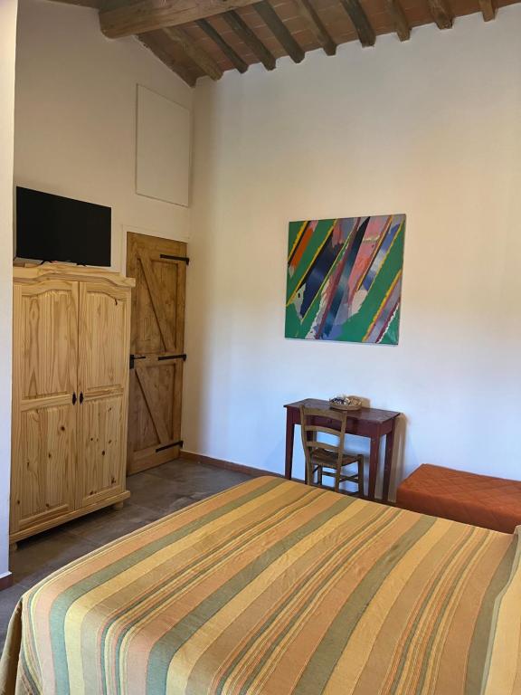 Postel nebo postele na pokoji v ubytování Camera tripla Il Picchio Verde
