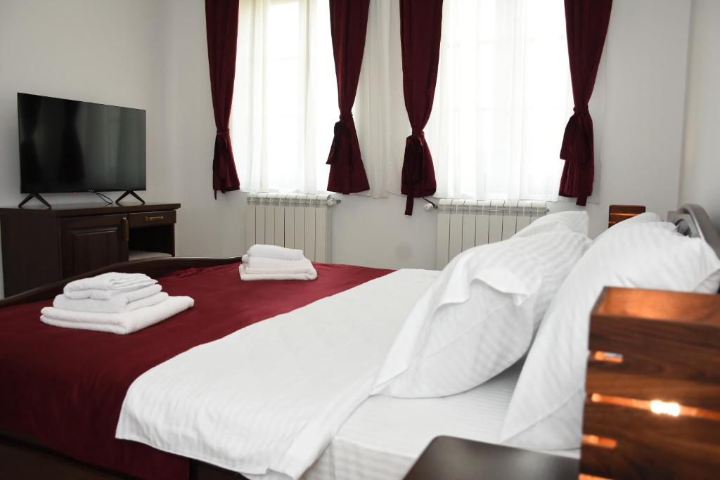 Postel nebo postele na pokoji v ubytování Kod Bogdanovica
