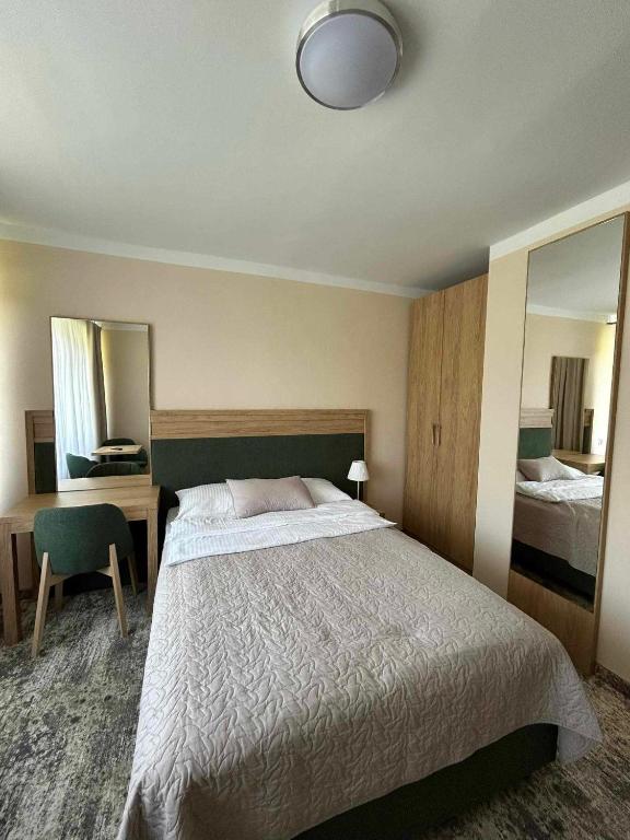 Postel nebo postele na pokoji v ubytování Zem-Tourist
