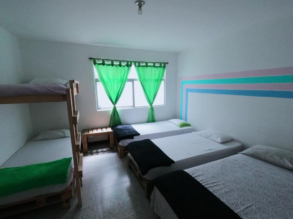 Postel nebo postele na pokoji v ubytování Hostal paz y vida