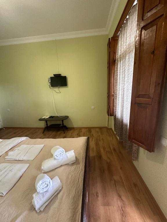 Postel nebo postele na pokoji v ubytování Tyupebi