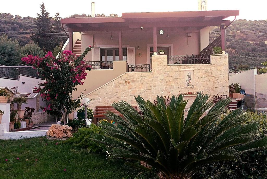 a house with a balcony on top of it at Verdalia Private Holiday House in Stavrákia