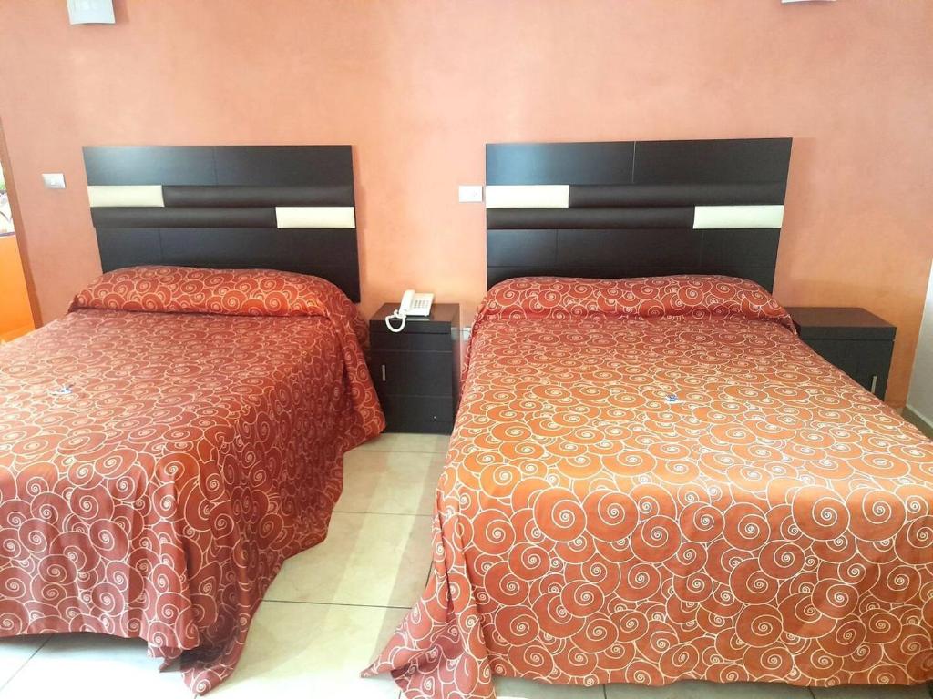 Postel nebo postele na pokoji v ubytování Hotel Posada Del Parque