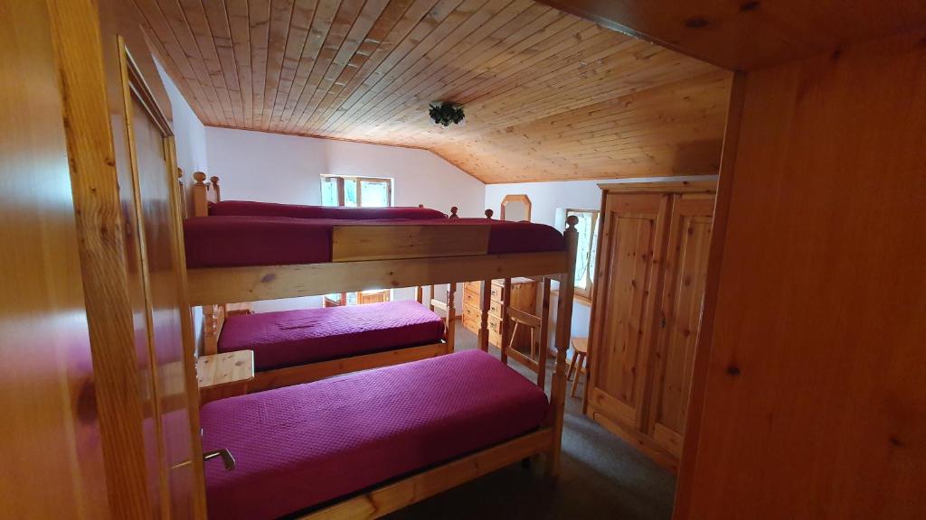 Postel nebo postele na pokoji v ubytování Appartamenti Nonno Gianni