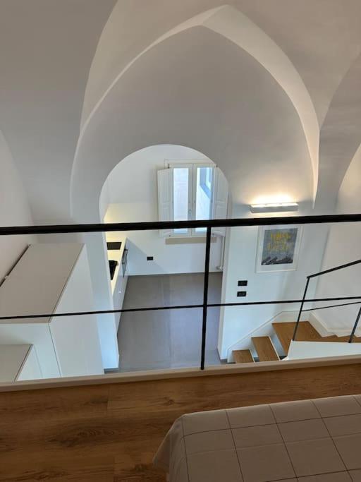Postel nebo postele na pokoji v ubytování Design, comfort e atmosfera nel cuore del Salento