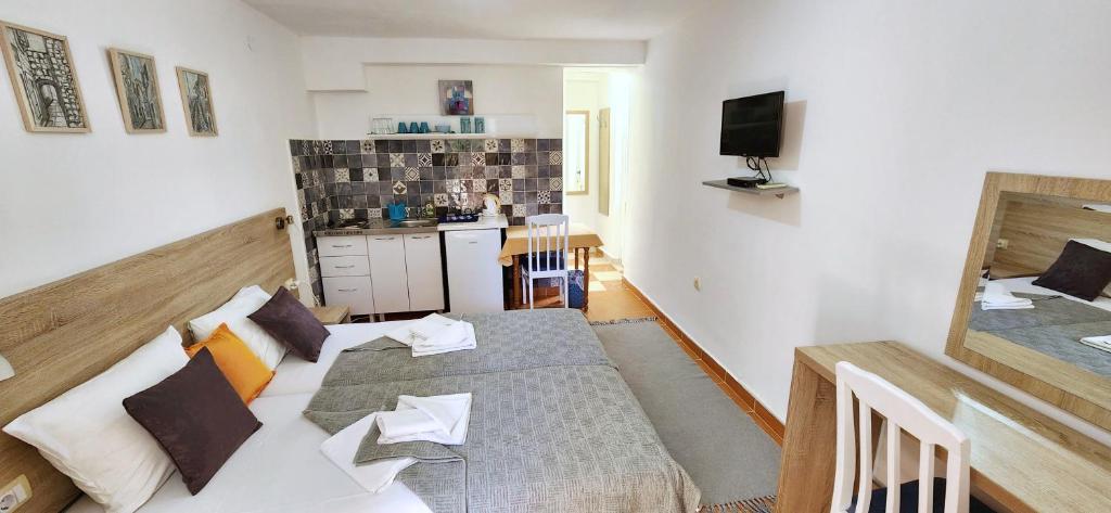 Postel nebo postele na pokoji v ubytování Guesthouse Tri Palme