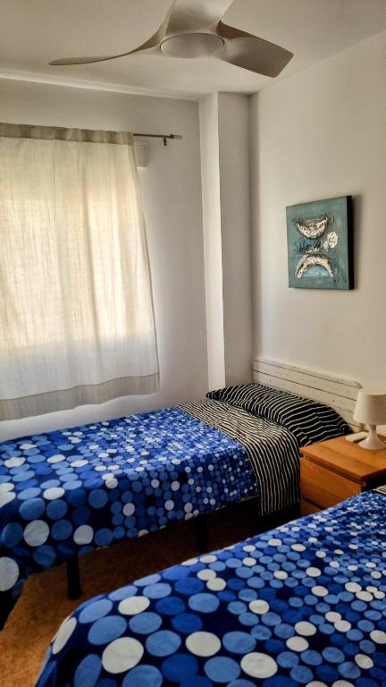 A bed or beds in a room at Hello Oliva Beach Ana