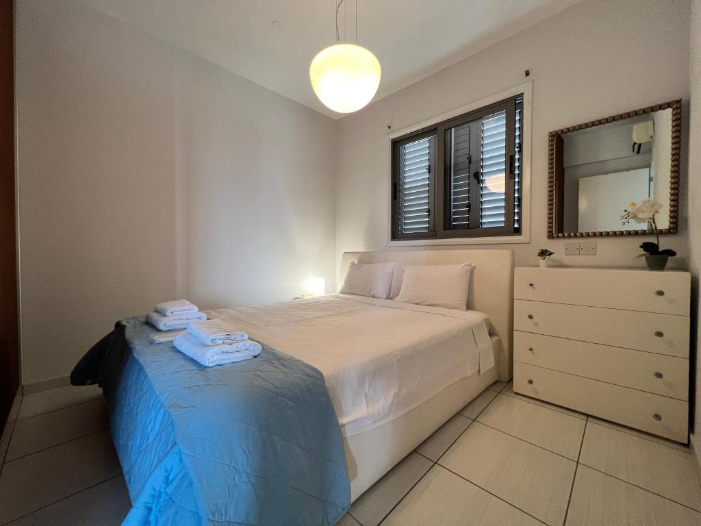 Postel nebo postele na pokoji v ubytování Queens Boutique Apartment 2BR