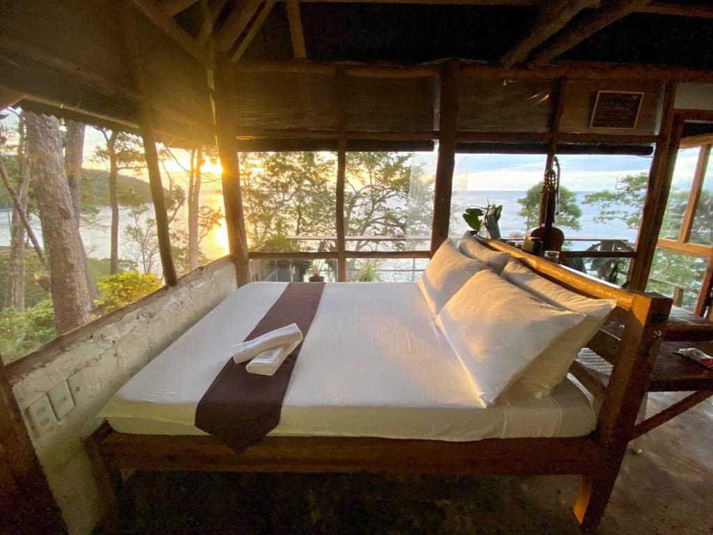 Postel nebo postele na pokoji v ubytování Serenity Palawan