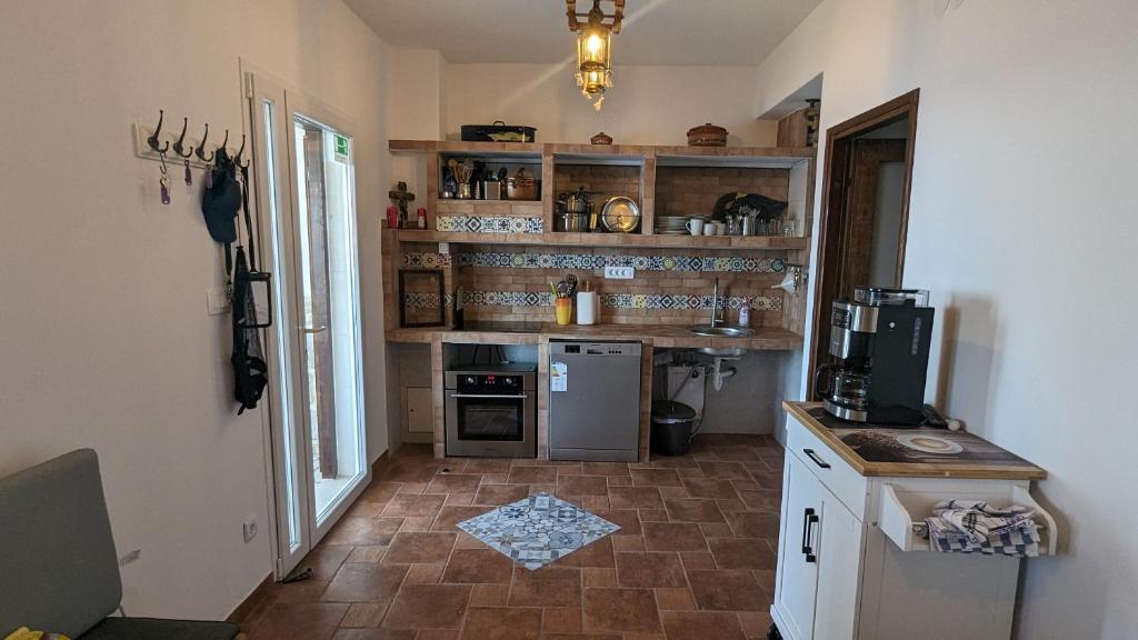Kuchyň nebo kuchyňský kout v ubytování Paradies Apartments Prizba