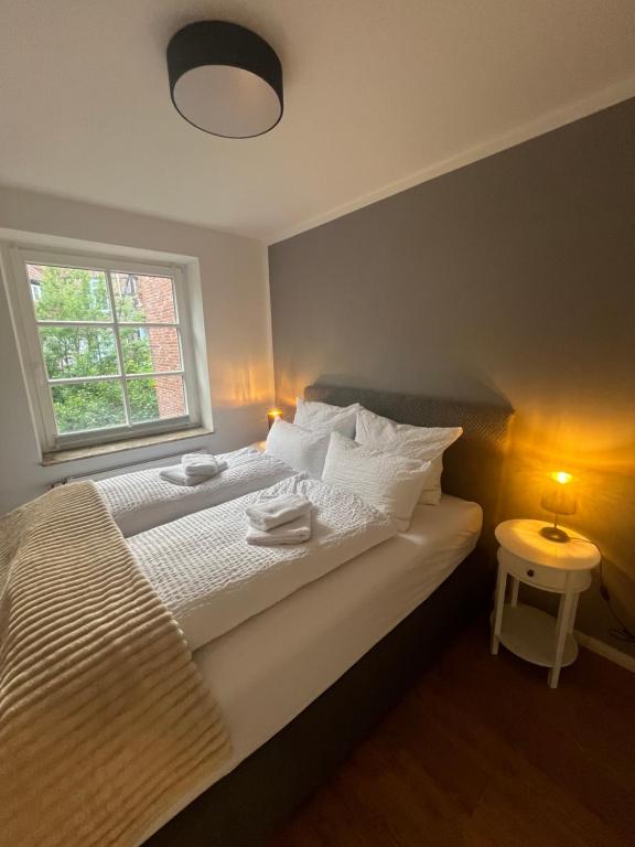 Postel nebo postele na pokoji v ubytování Zeitapartments Am Fischmarkt