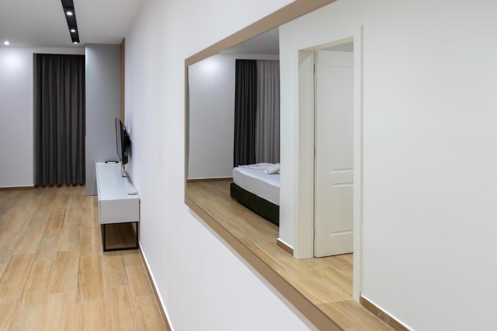 Postel nebo postele na pokoji v ubytování Suite Hotel