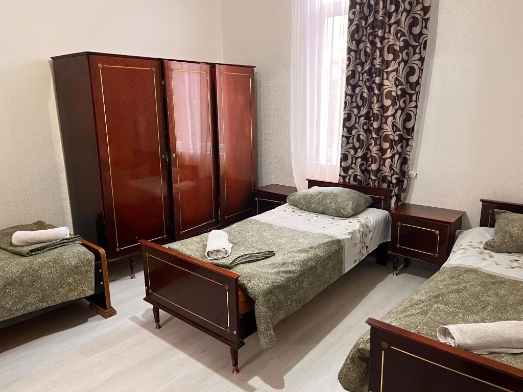 Postel nebo postele na pokoji v ubytování საოჯახო სასტუმრო დეა