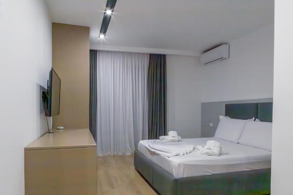 Postel nebo postele na pokoji v ubytování Suite Hotel