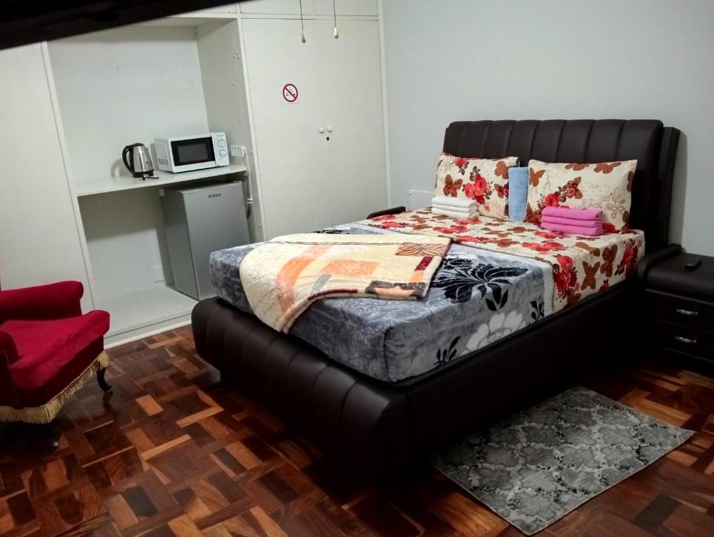 Ένα ή περισσότερα κρεβάτια σε δωμάτιο στο Moonlight Guest House